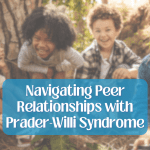 A group of young kids with Prader-Willi syndrome laugh and smile while sitting under a tree